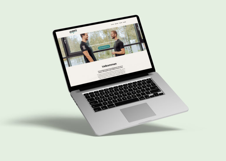 Digital mockup av hjemmeside inni macbook