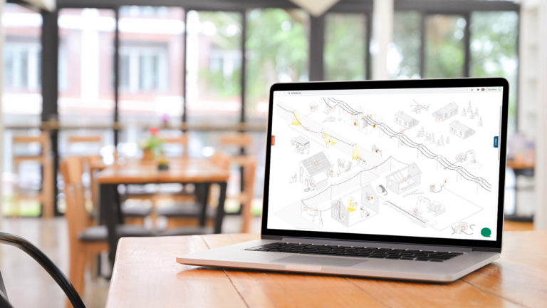 Mockup av nettside på mackbook, café i bakgrunn